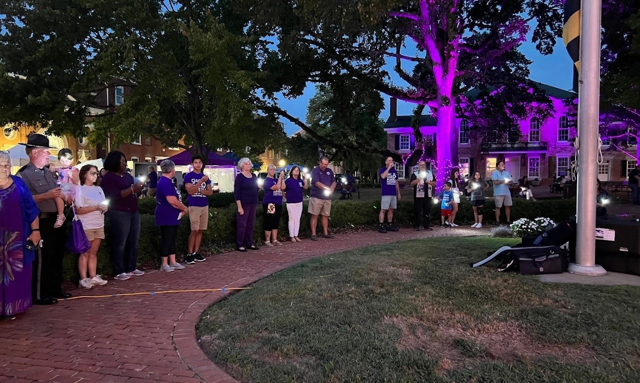 QAC Goes Purple candlelight community event